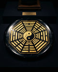 Circular black obsidian ritual plate with traditional carvings - main view