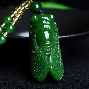 Jade cicada pendant styled on neck